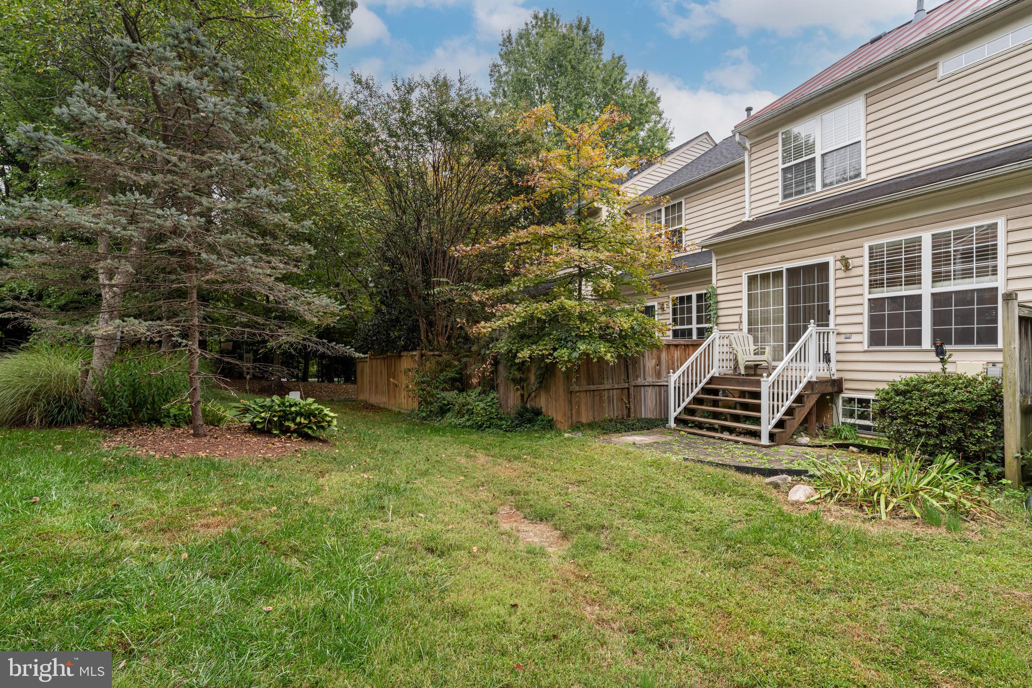 11444 Heritage Commons Way Reston, VA 20194 - Photo 34 of 35 a view of a house with backyard and sitting area