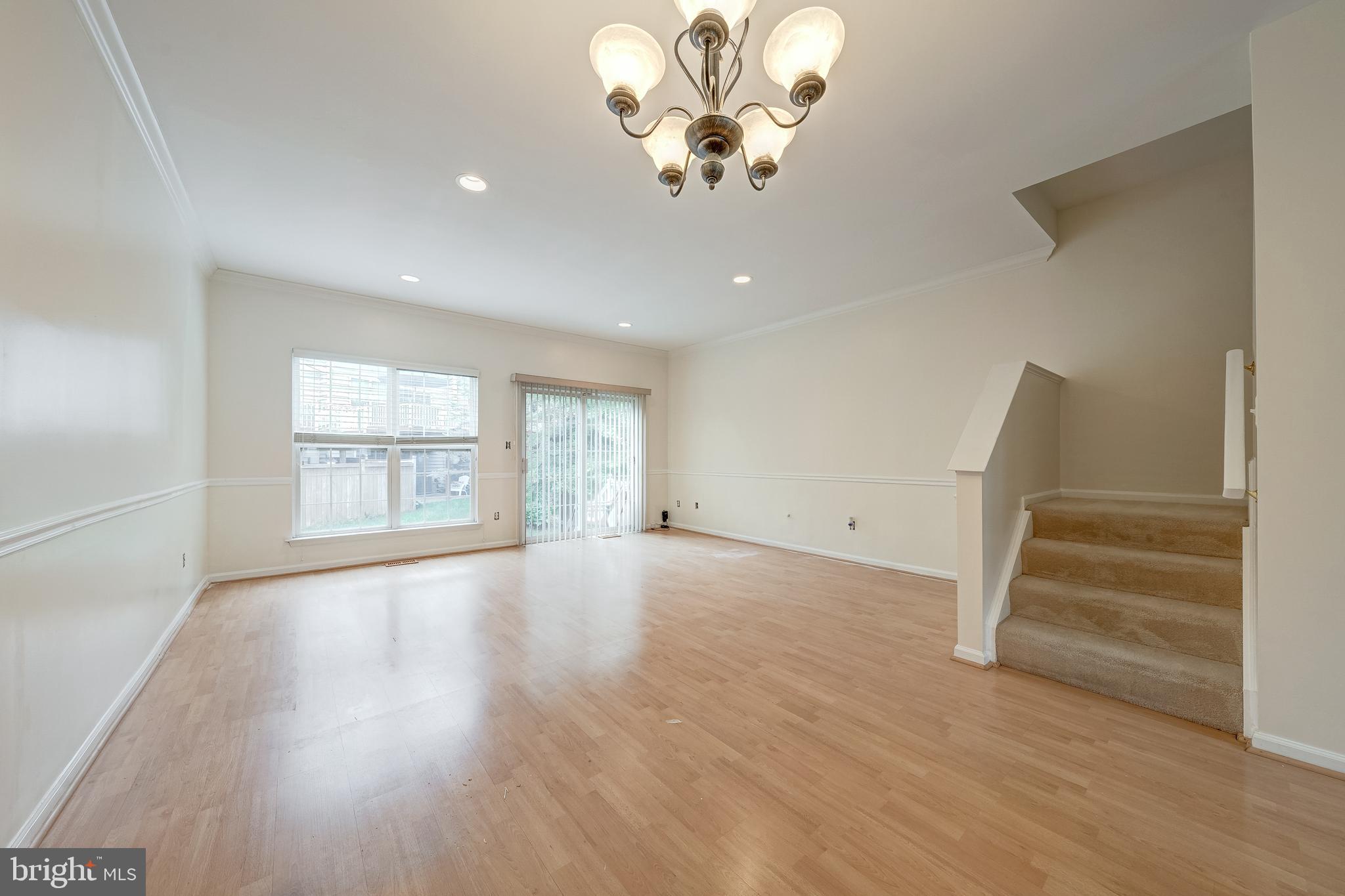 11444 Heritage Commons Way Reston, VA 20194 - Photo 4 of 35 an empty room with wooden floor and windows
