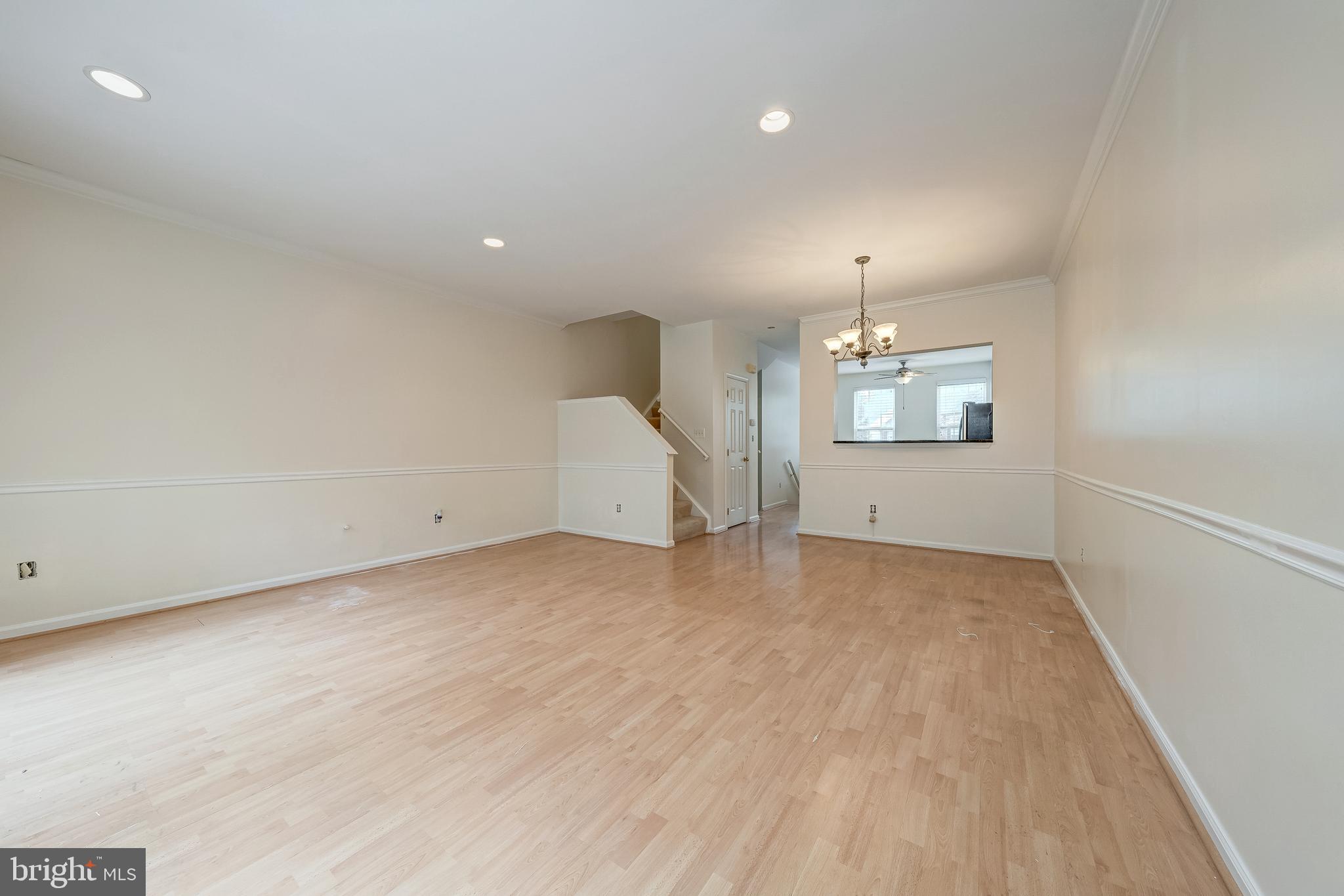 11444 Heritage Commons Way Reston, VA 20194 - Photo 5 of 35 an empty room with chandelier fan and windows