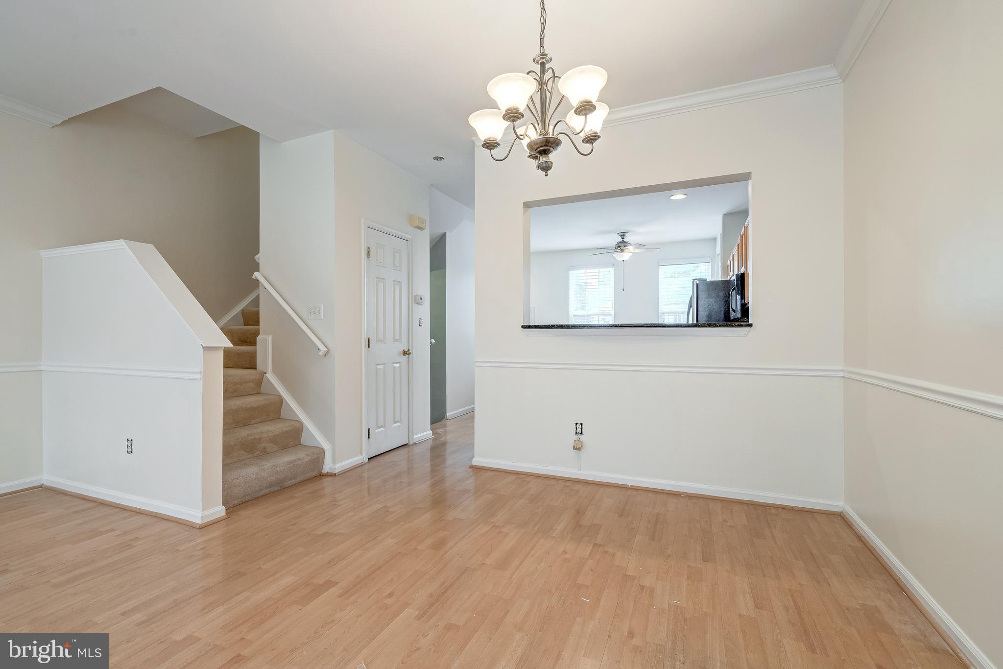 11444 Heritage Commons Way Reston, VA 20194 - Photo 7 of 35 a view of a livingroom with wooden floor and staircase