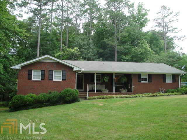 1405 Roper Road, Unit 133 294 Canton, GA 30115 - Photo 1 of 1 a front view of a house with garden