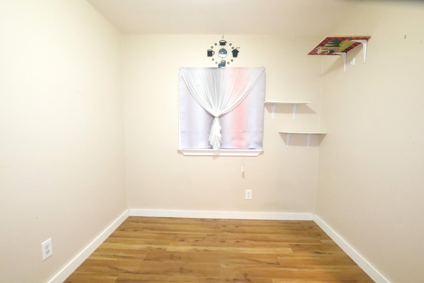 2855 Senter Road, Unit 10 San Jose, CA 95111 - Photo 11 of 15 a view of a room with wooden floor and cabinet