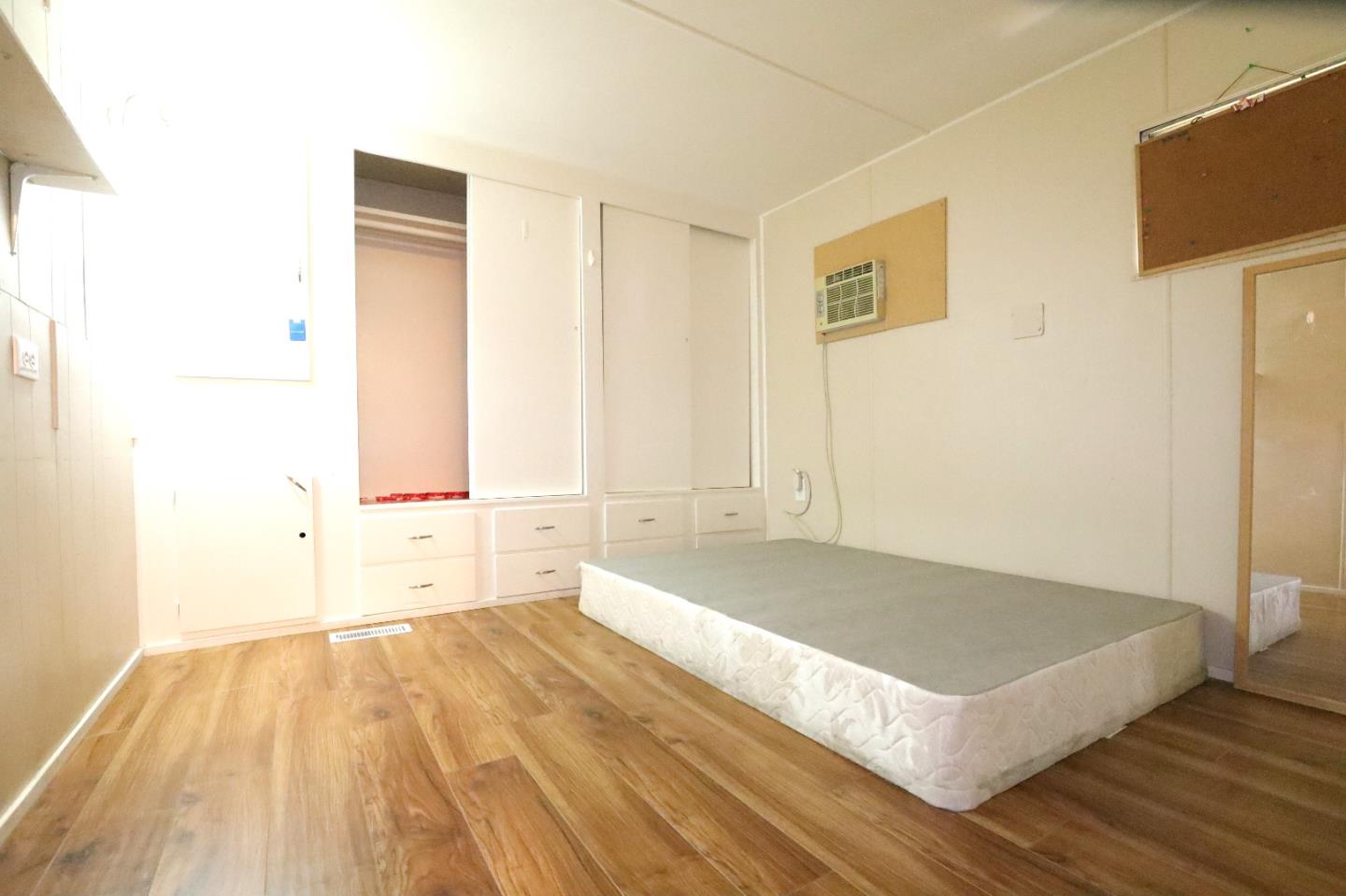 2855 Senter Road, Unit 10 San Jose, CA 95111 - Photo 7 of 15 a view of a room with wooden floor and cabinet