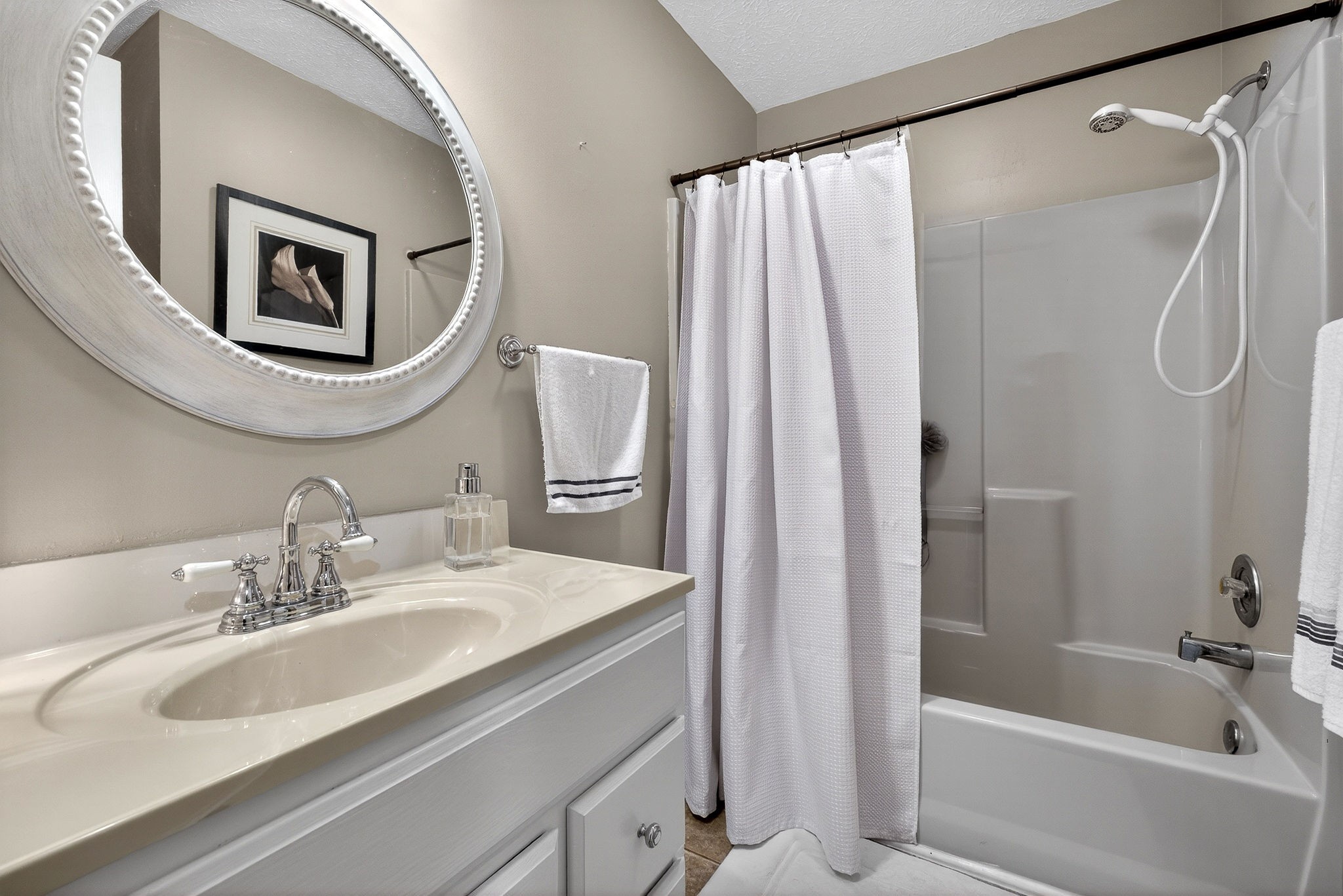 1755 Burgess Falls Road Sparta, TN 38583 - Photo 34 of 56 a bathroom with a granite countertop sink a mirror a shower and a bathtub