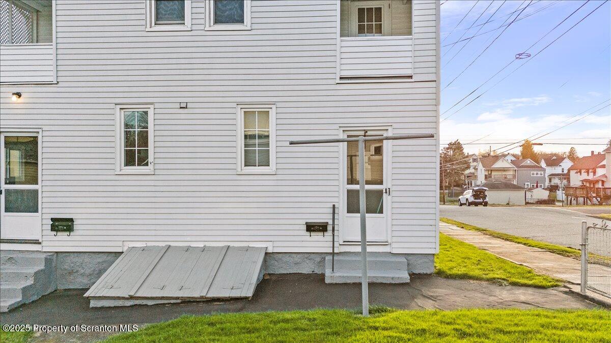 1446 Thackery Street Scranton, PA 18504 - Photo 12 of 25 a view of a white house with a swimming pool
