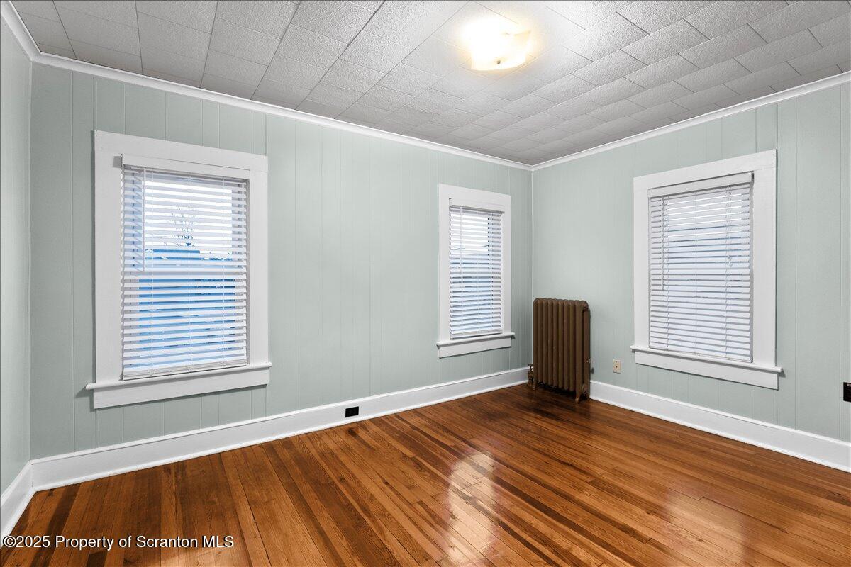 1446 Thackery Street Scranton, PA 18504 - Photo 15 of 25 a view of a room with wooden floor and furniture