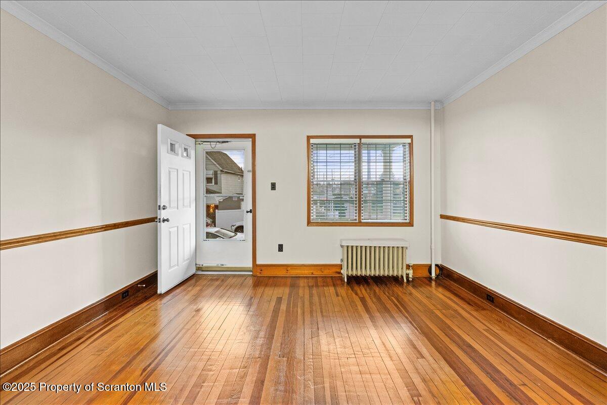 1446 Thackery Street Scranton, PA 18504 - Photo 2 of 25 a view of empty room with wooden floor