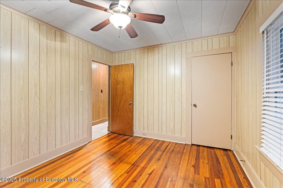1446 Thackery Street Scranton, PA 18504 - Photo 24 of 25 wooden floor in an empty room with a window