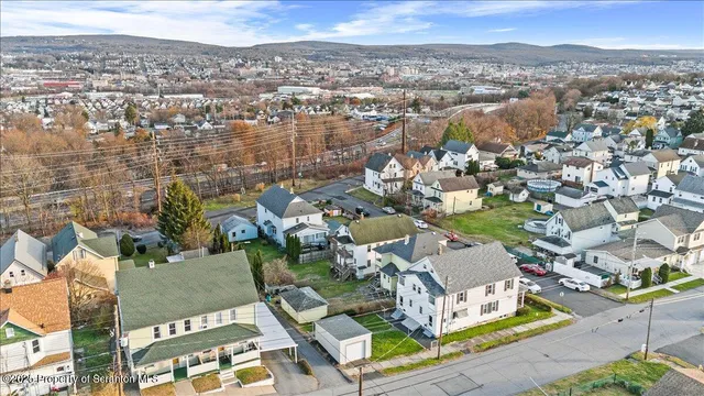 an aerial view of residential building with parking