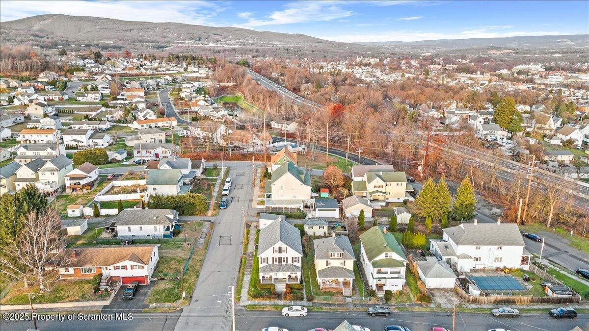 1446 Thackery Street Scranton, PA 18504 - Photo 8 of 25 an aerial view of residential houses with outdoor space