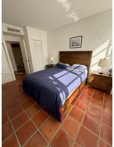 a bedroom with a bed and a fireplace