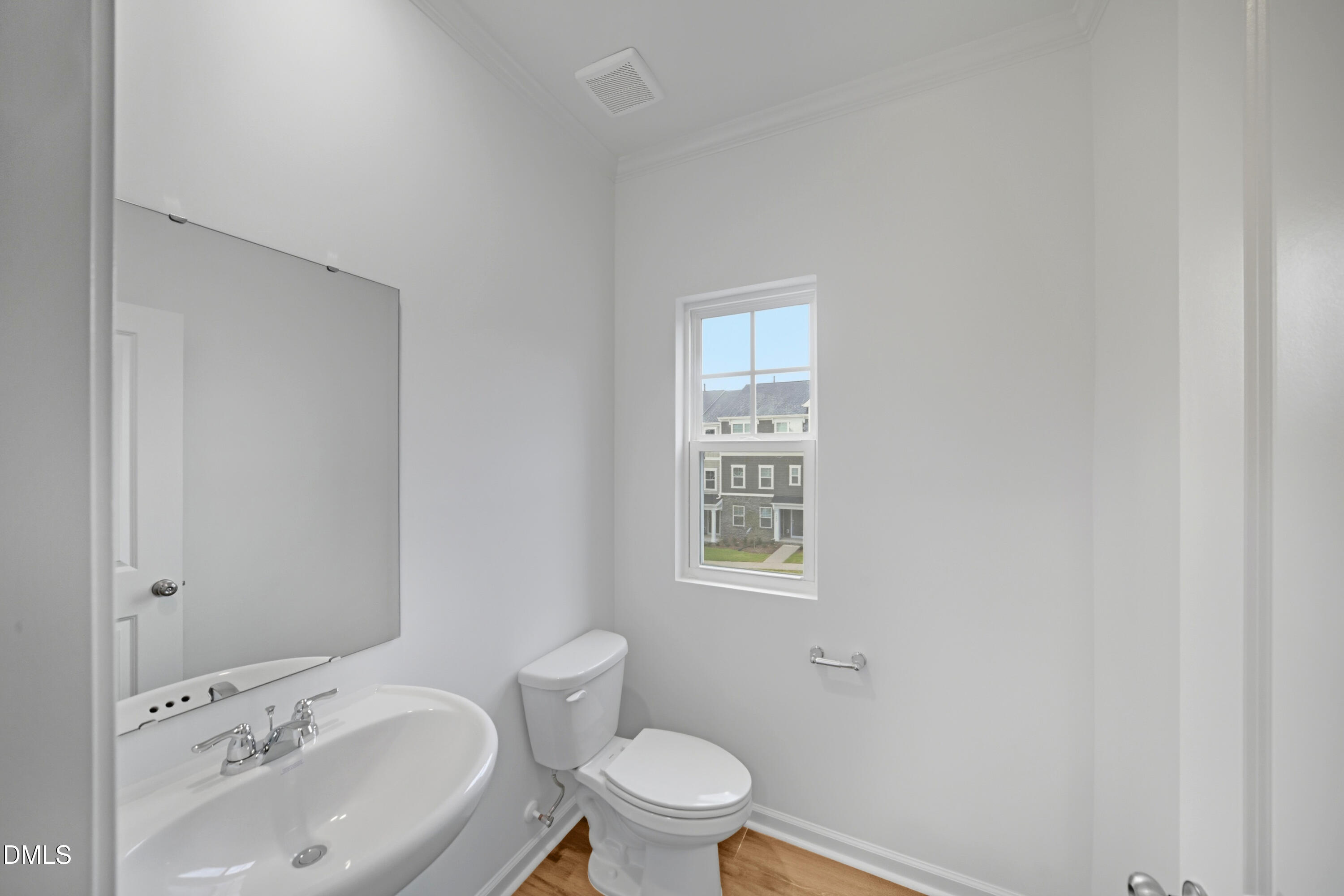 1445 Jay Road Knightdale, NC 27545 - Photo 18 of 58 a bathroom with a sink toilet and a mirror