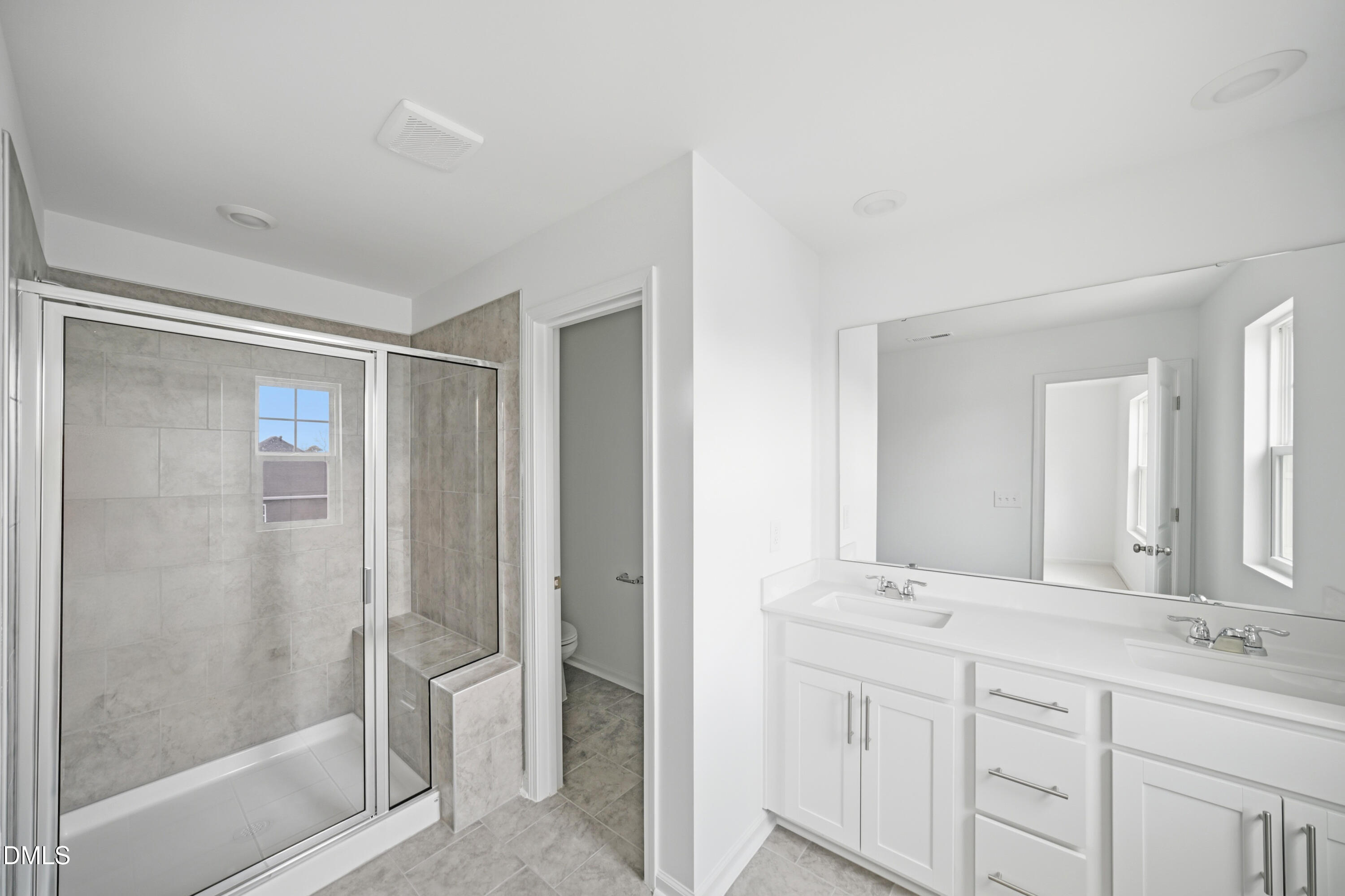 1445 Jay Road Knightdale, NC 27545 - Photo 22 of 58 a bathroom with double sink and a mirror