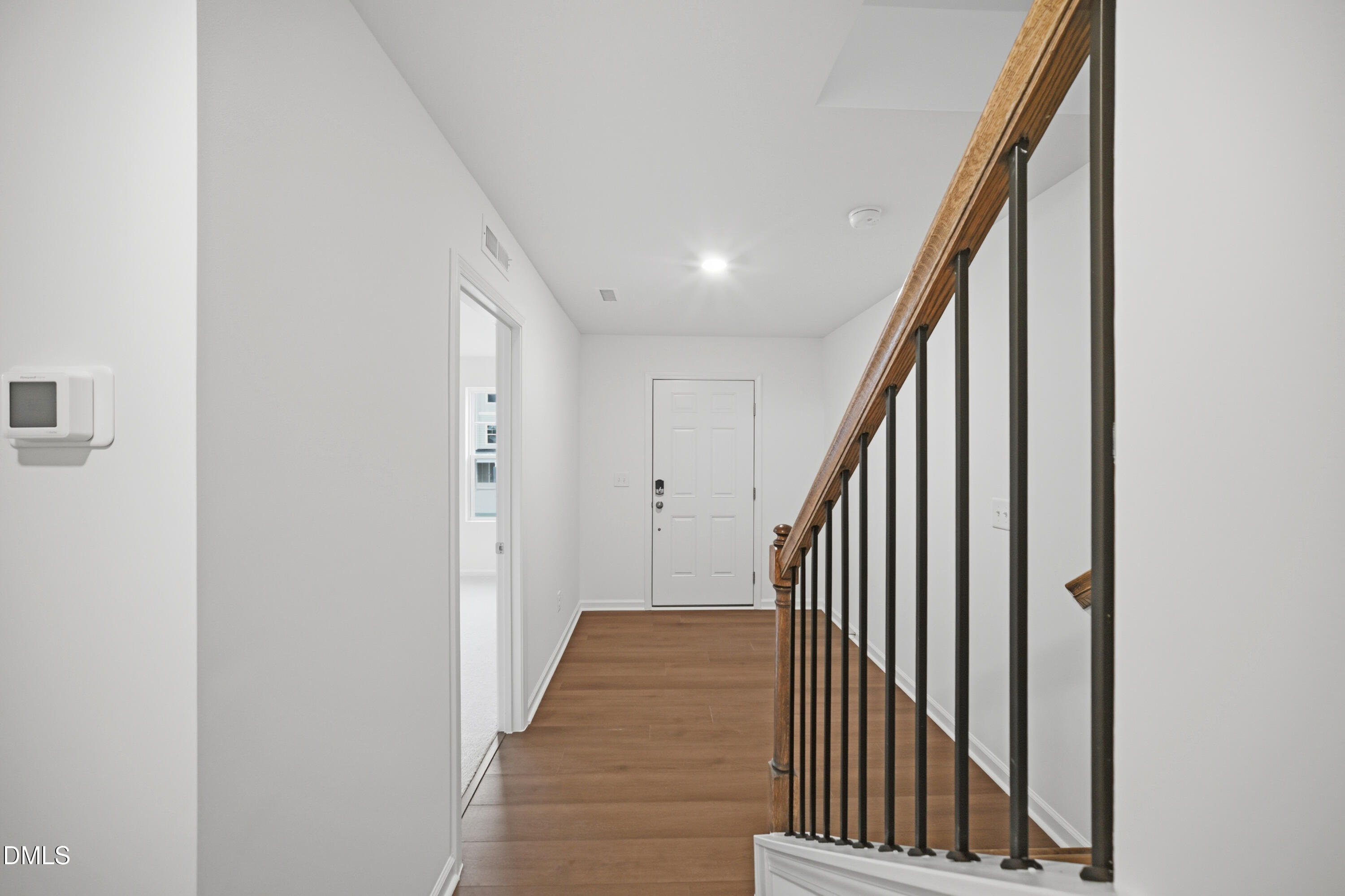 1445 Jay Road Knightdale, NC 27545 - Photo 3 of 58 a view of a hallway with wooden floor and staircase