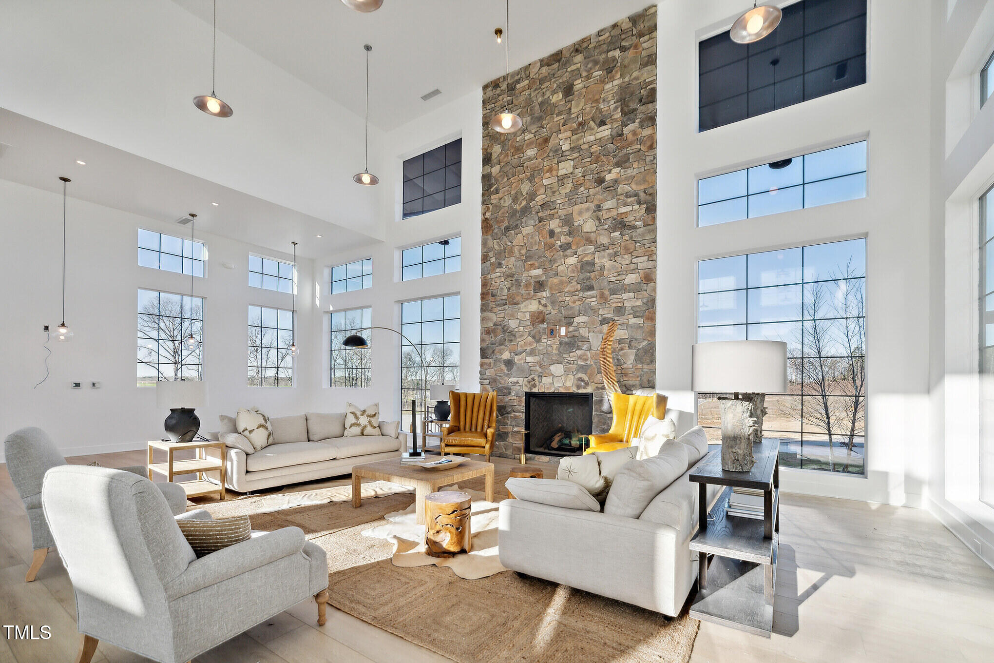 1445 Jay Road Knightdale, NC 27545 - Photo 50 of 58 a living room with furniture and a fireplace