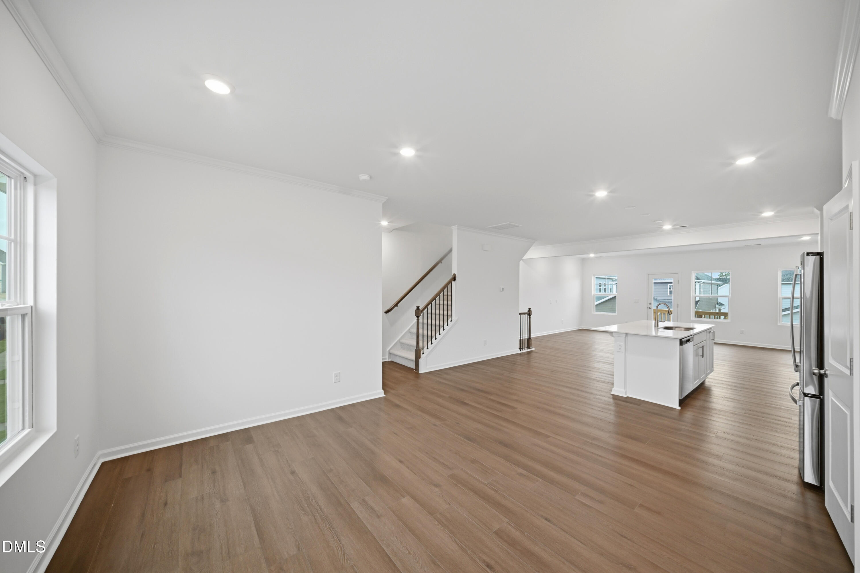 1445 Jay Road Knightdale, NC 27545 - Photo 9 of 58 a view of empty room with wooden floor and windows
