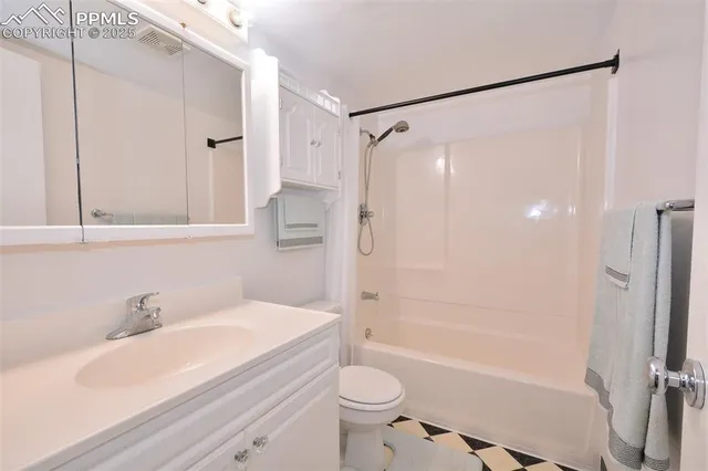 a view of an empty room with empty shelves