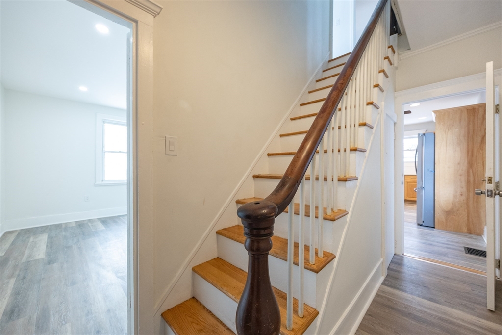 153 West Street Randolph, MA 02368 - Photo 15 of 33 a view of an entryway with wooden floor and stairs