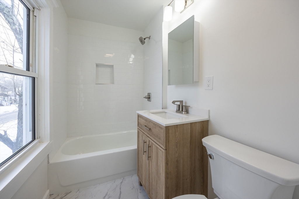 153 West Street Randolph, MA 02368 - Photo 23 of 33 a bathroom with a sink a toilet and a bathtub