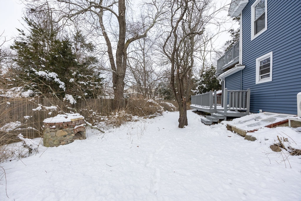 153 West Street Randolph, MA 02368 - Photo 30 of 33 a view of backyard with a table and chairs and a fire pit