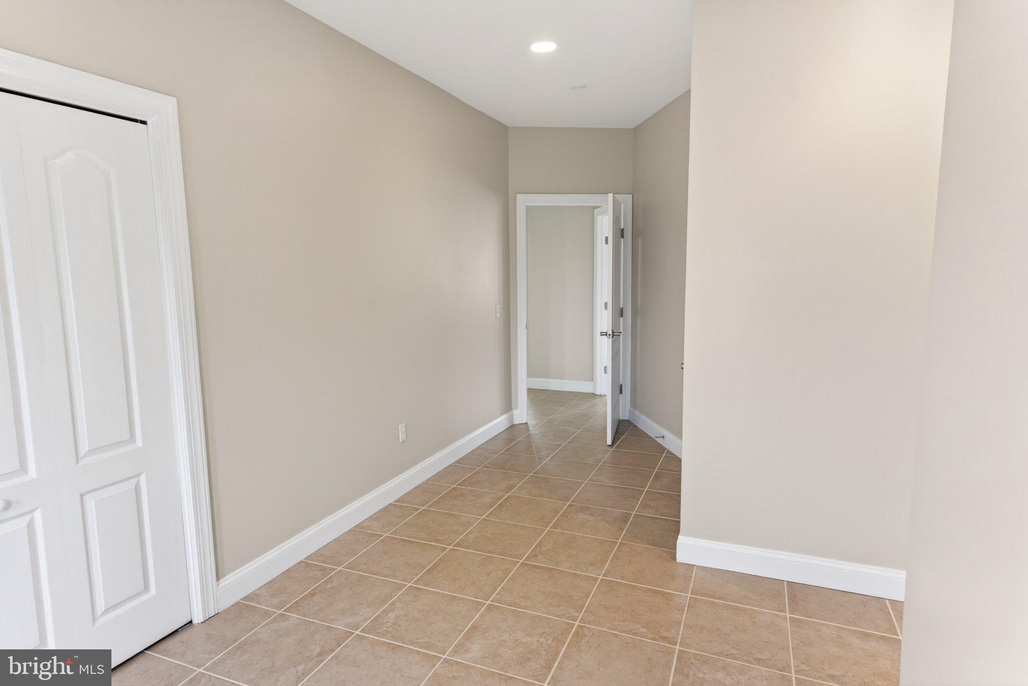 34029 Peppers Corner Road Millville, DE 19967 - Photo 15 of 101 Spacious entryway with modern tiles.