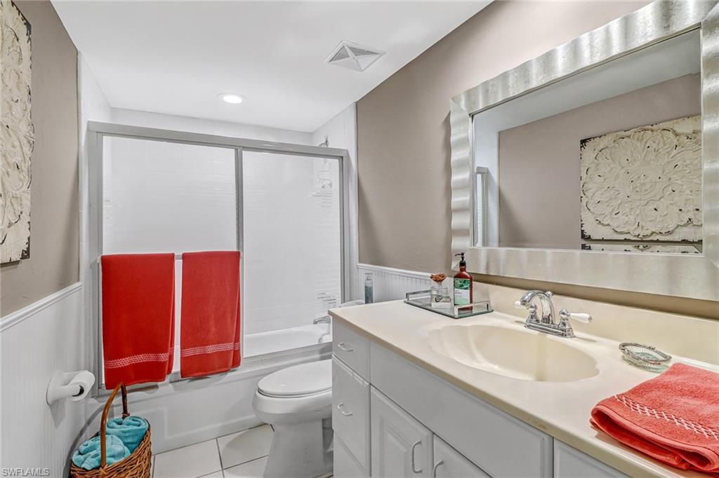 600 Valley Stream Drive, Unit E8 Naples, FL 34113 - Photo 11 of 21 a bathroom with a sink a toilet and shower