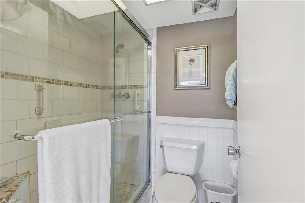 600 Valley Stream Drive, Unit E8 Naples, FL 34113 - Photo 14 of 21 a bathroom with a toilet sink and shower