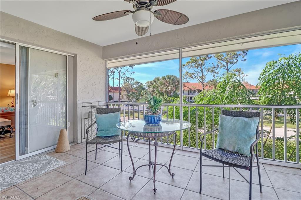600 Valley Stream Drive, Unit E8 Naples, FL 34113 - Photo 17 of 21 a dining room with furniture and window view