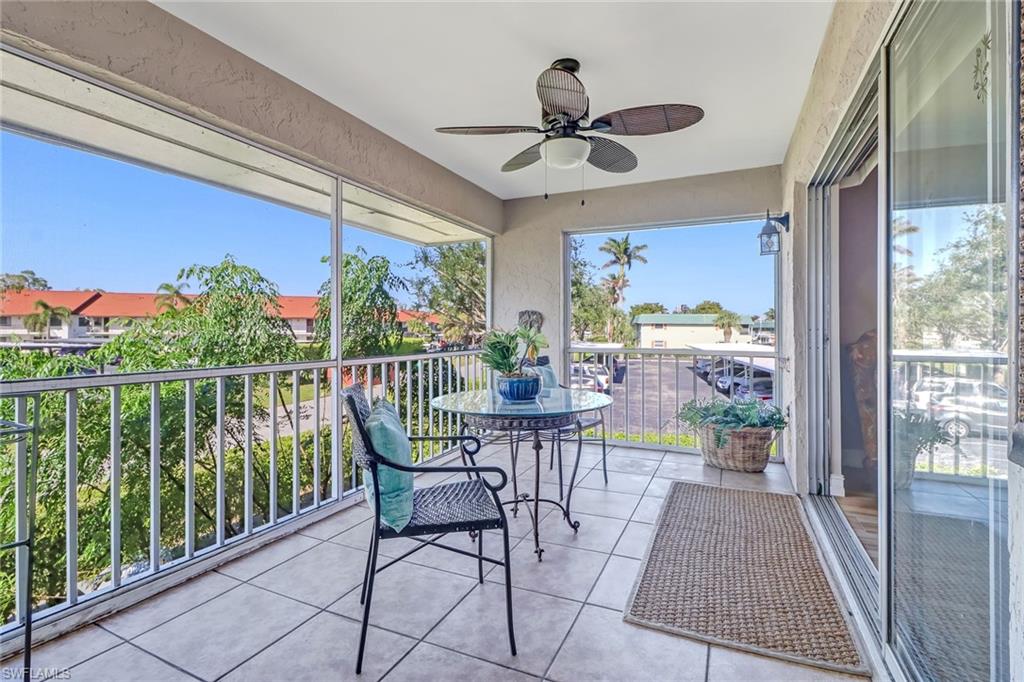 600 Valley Stream Drive, Unit E8 Naples, FL 34113 - Photo 18 of 21 a view of a balcony with furniture