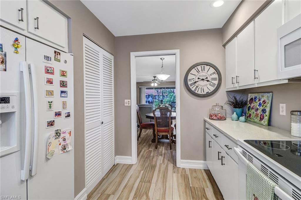 600 Valley Stream Drive, Unit E8 Naples, FL 34113 - Photo 4 of 21 a view of a hallway with washer and dryer