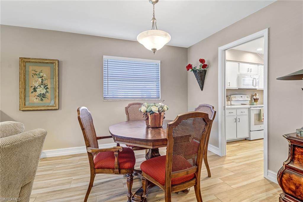 600 Valley Stream Drive, Unit E8 Naples, FL 34113 - Photo 5 of 21 a dining room with furniture and window