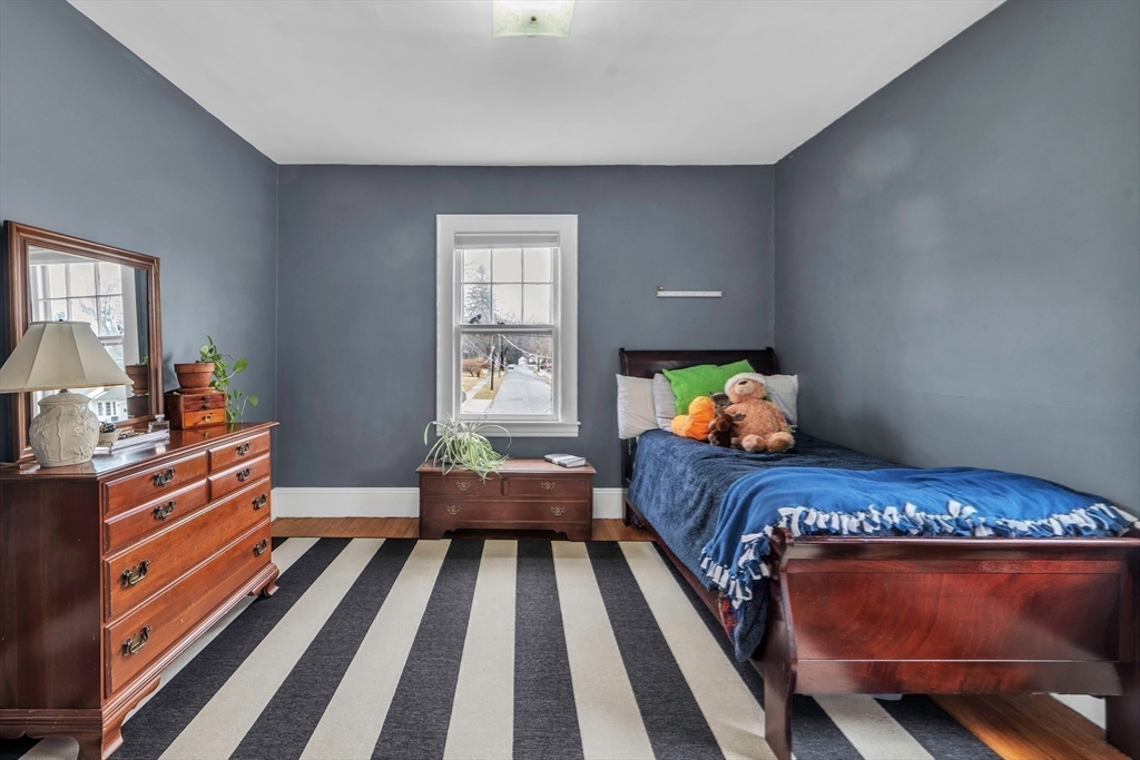 138 Maple Road Longmeadow, MA 01106 - Photo 23 of 37 a bedroom with a bed and wooden floor