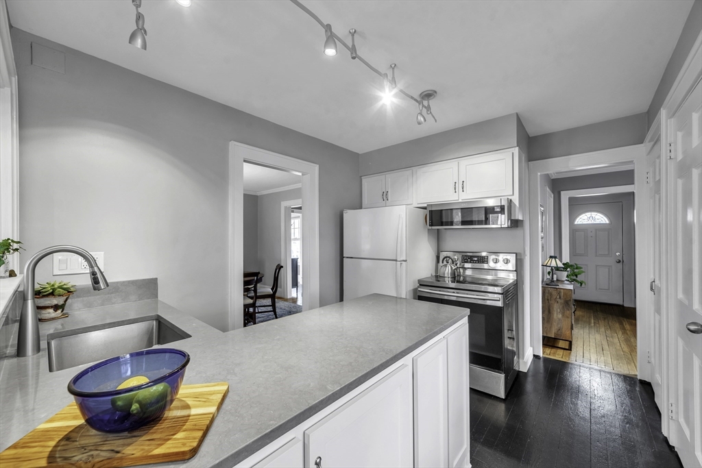 138 Maple Road Longmeadow, MA 01106 - Photo 6 of 37 a kitchen with stainless steel appliances granite countertop a sink dishwasher stove and refrigerator with wooden floor