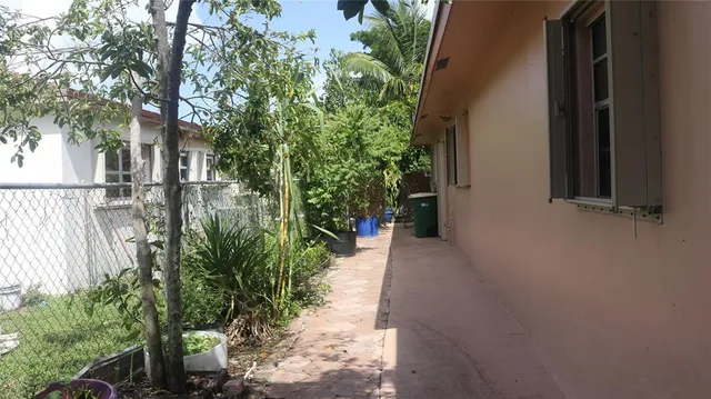 a view of a backyard of the house