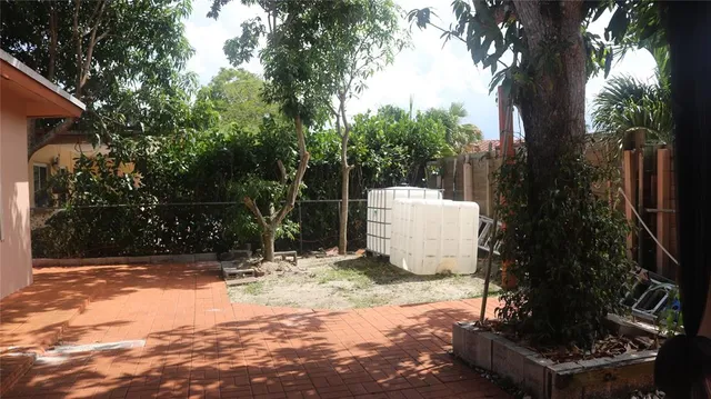 a backyard of a house with lots of green space