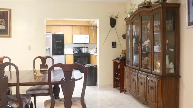 a view of a balcony dining table and chairs