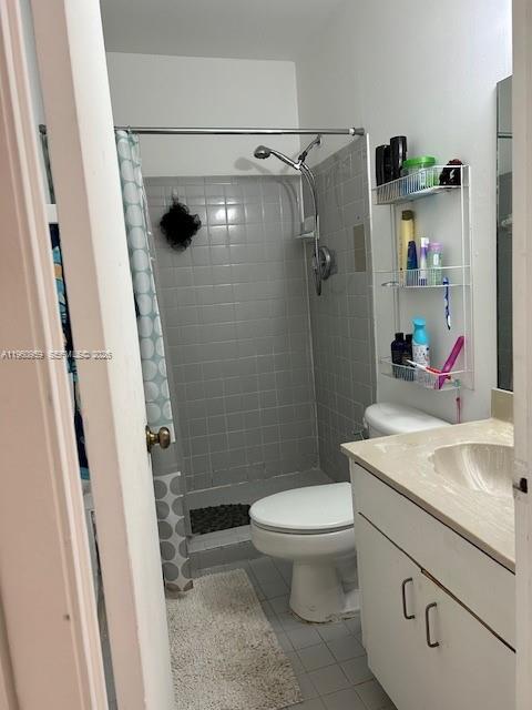 11301 Southwest 200th Street, Unit 109A Miami, FL 33157 - Photo 8 of 13 a bathroom with a sink a toilet and shower
