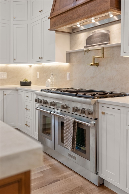 82 Deer Path Lane Weston, MA 02493 - Photo 9 of 42 a stove top oven sitting inside of a kitchen
