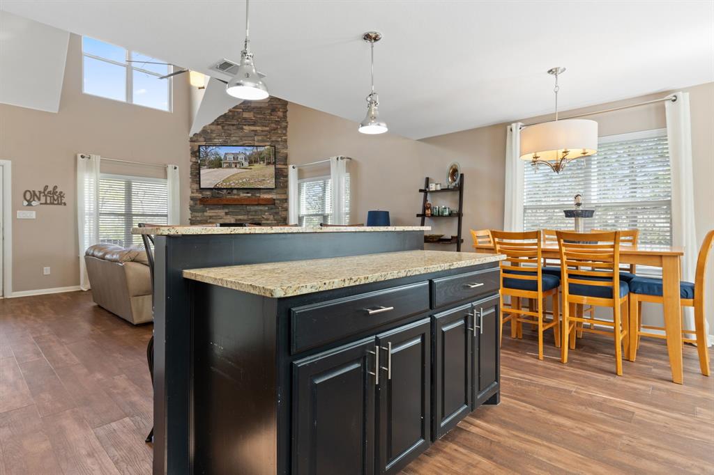 150 Spanish Trail Pottsboro, TX 75076 - Photo 11 of 36 a kitchen with stainless steel appliances granite countertop a stove and a refrigerator