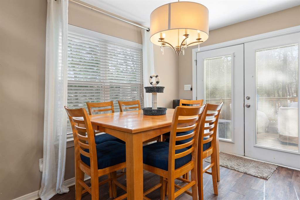 150 Spanish Trail Pottsboro, TX 75076 - Photo 13 of 36 a view of a dining room with furniture and wooden floor