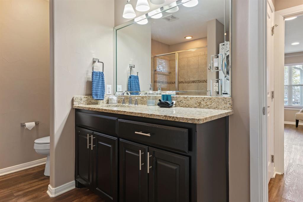 150 Spanish Trail Pottsboro, TX 75076 - Photo 16 of 36 a bathroom with a sink a vanity and a mirror