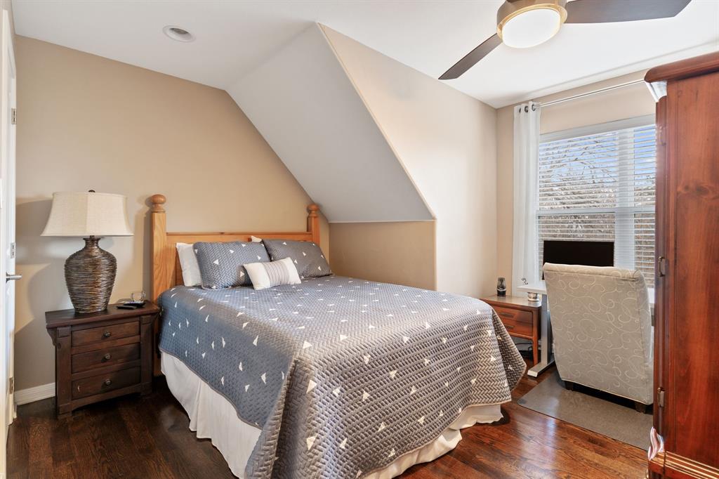 150 Spanish Trail Pottsboro, TX 75076 - Photo 20 of 36 a bedroom with a bed and wooden floor