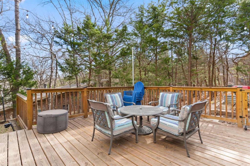 150 Spanish Trail Pottsboro, TX 75076 - Photo 22 of 36 a view of a chair and table on the wooden floor