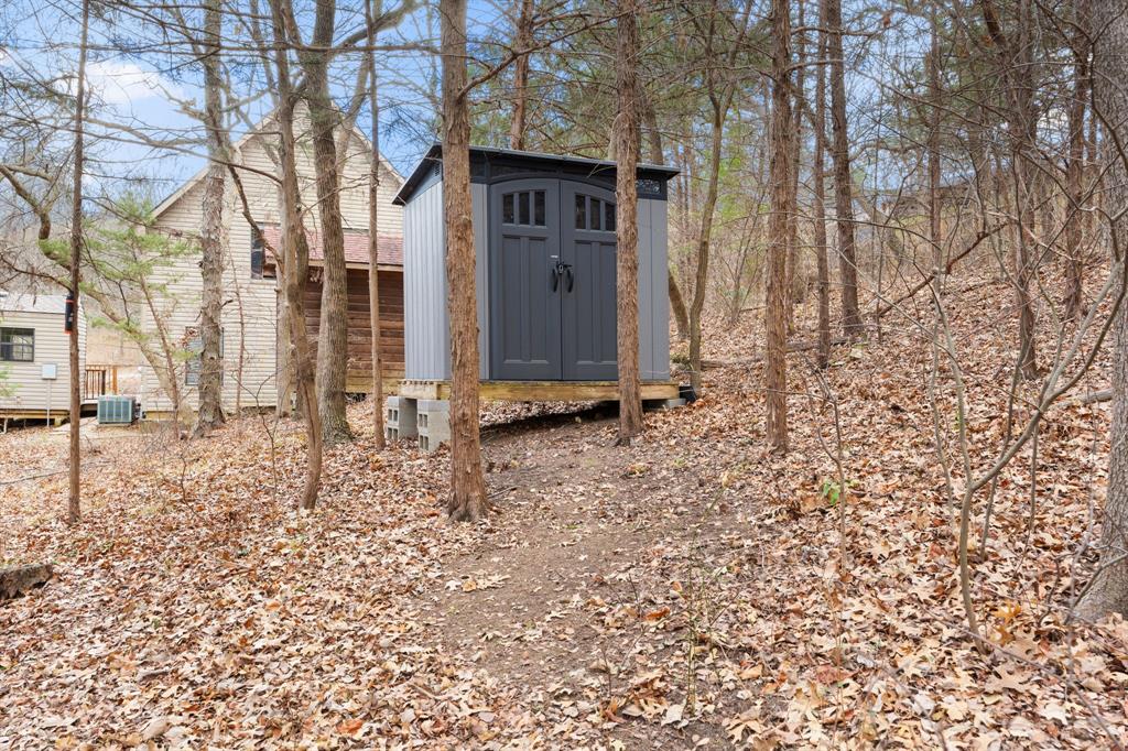 150 Spanish Trail Pottsboro, TX 75076 - Photo 28 of 36 a view of a house with a yard