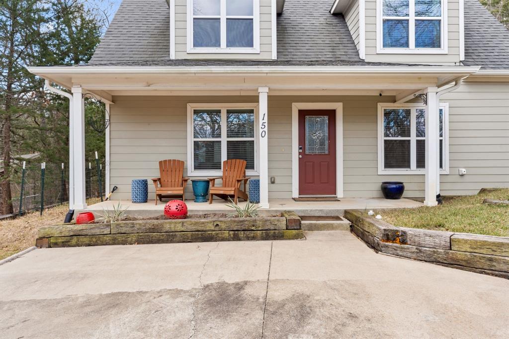 150 Spanish Trail Pottsboro, TX 75076 - Photo 3 of 36 a front view of a house with garage