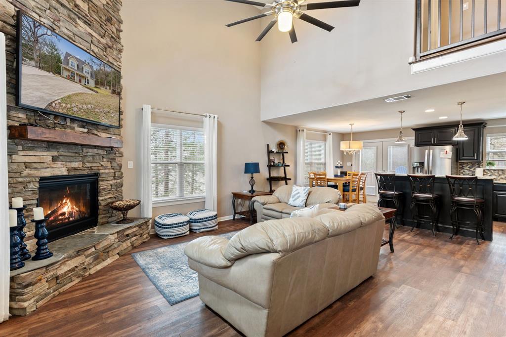 150 Spanish Trail Pottsboro, TX 75076 - Photo 4 of 36 a living room with furniture and a fireplace