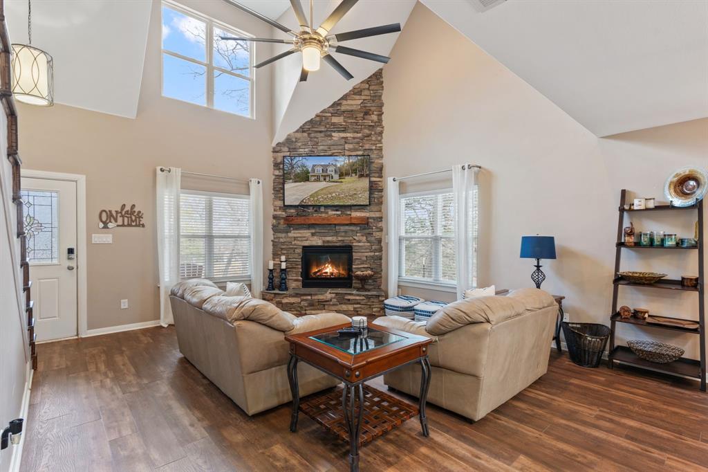 150 Spanish Trail Pottsboro, TX 75076 - Photo 5 of 36 a living room with furniture and a fireplace