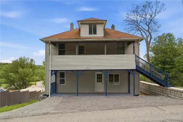 a front view of a house with a garage