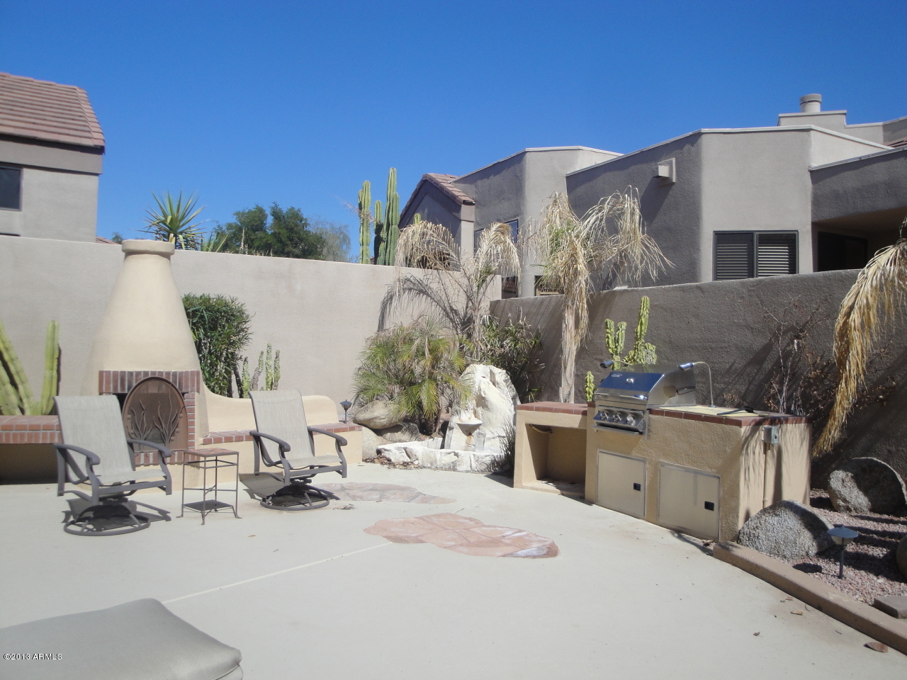 7740 East Gainey Ranch Road, Unit 46 Scottsdale, AZ 85258 - Photo 2 of 21 BACK YARD W BBQ & FIREPLACE