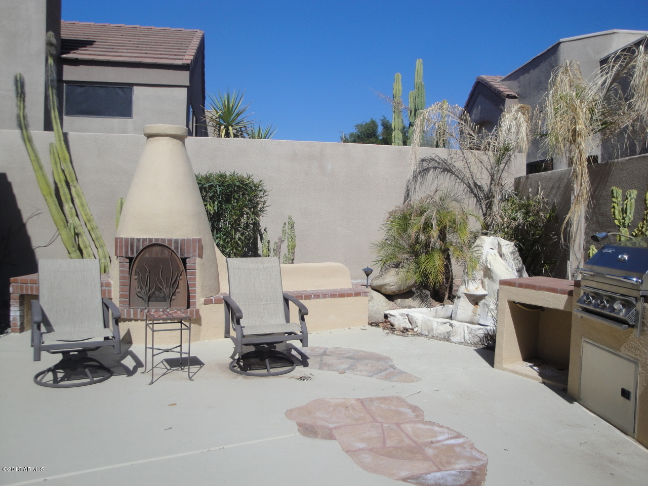 7740 East Gainey Ranch Road, Unit 46 Scottsdale, AZ 85258 - Photo 3 of 21 GAS FIREPLACE ON PATIO